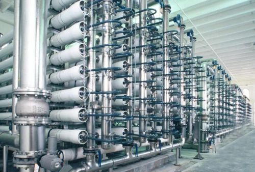 Industrial water treatment facility with blue spherical tanks